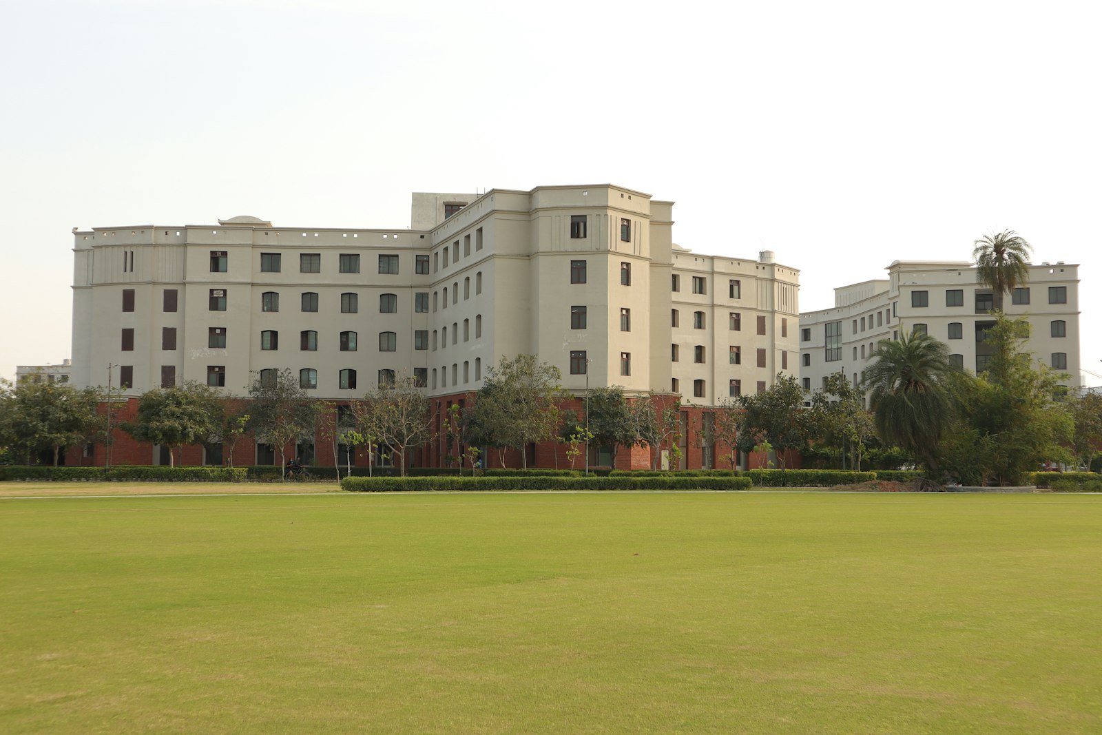School campus with green lawn – representative image