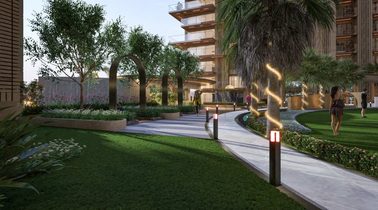 Landscaped garden walkway with arches and palms at The Autograph, Vaishali West, Jaipur